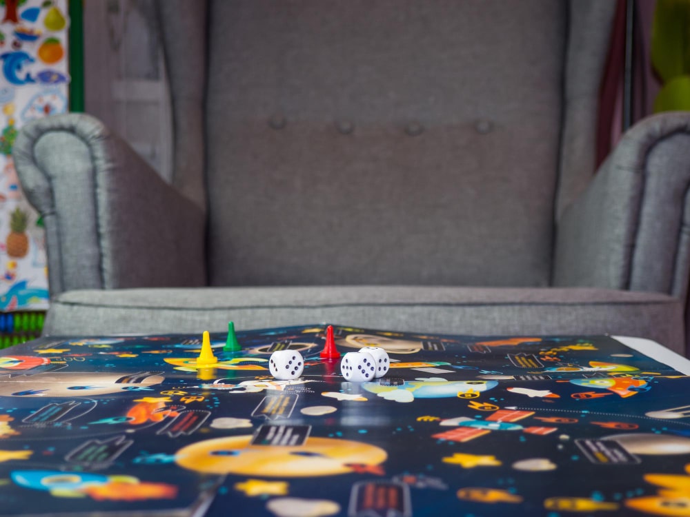 board-games-concept-dice-chips-and-cards-on-the-background-of-the-playing-field-copy-space